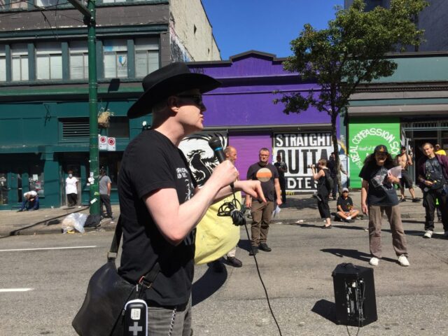 IMG_3297 Garth Mullins speaking on a microphone