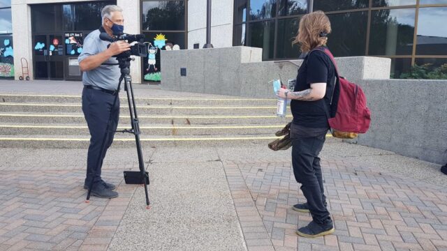 Lethbridge SCS Rally 6 Harm reduction worker being interviewed by media