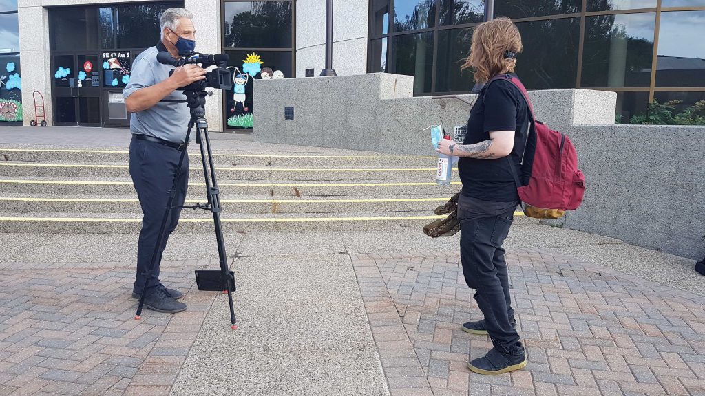 Harm reduction worker being interviewed by media
