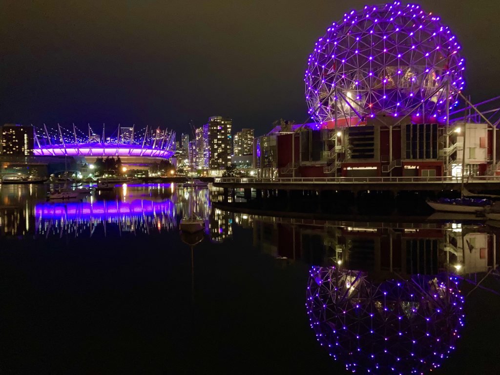 BC Place Stadium and Science World lit up in purple lights