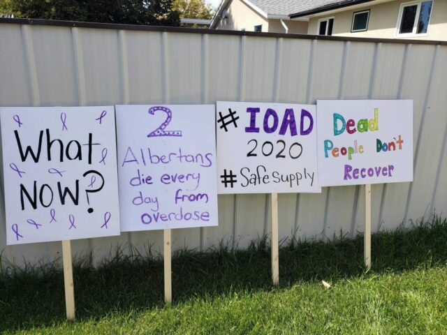 Lethbridge SCS Rally 1 Protest signs leaning against a fence