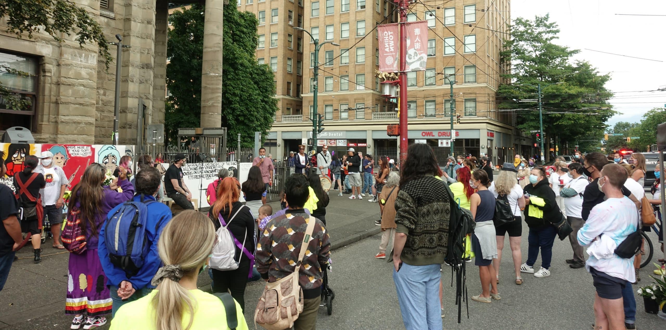 A large crowd gathered at the corner of Main and Hastings Street in Vancouver