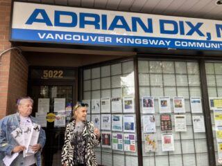 A person speaking to media at a press conference