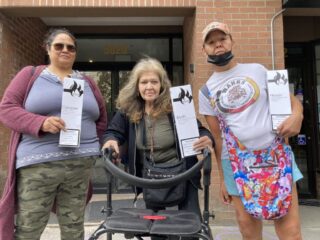Three people at a rally
