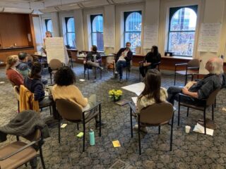 CDPC staff listening to a facilitator during staff retreat