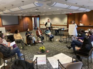 CDPC staff listening to a facilitator during staff retreat